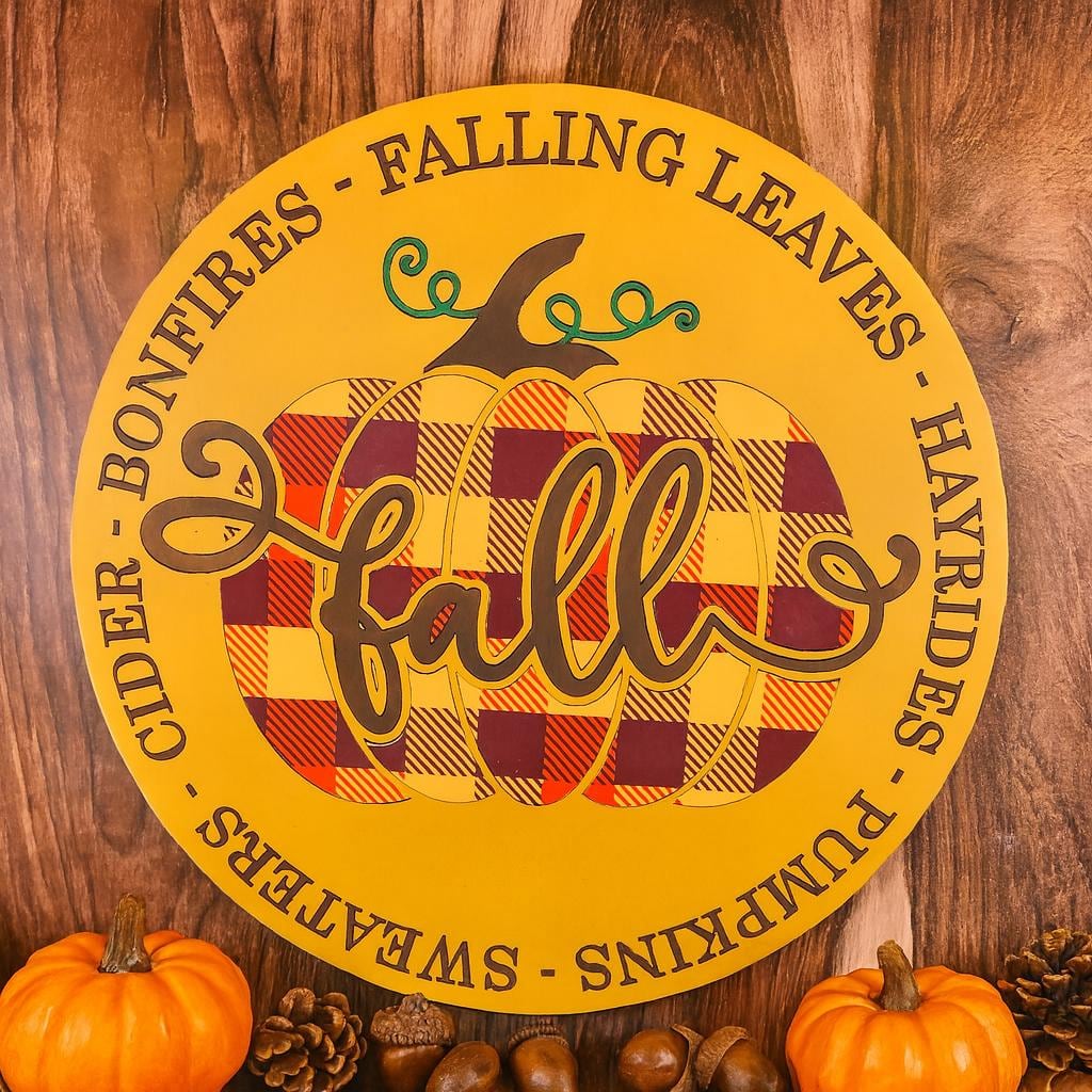 round fall sign with buffalo plaid pumpkin, shown in a styled setting